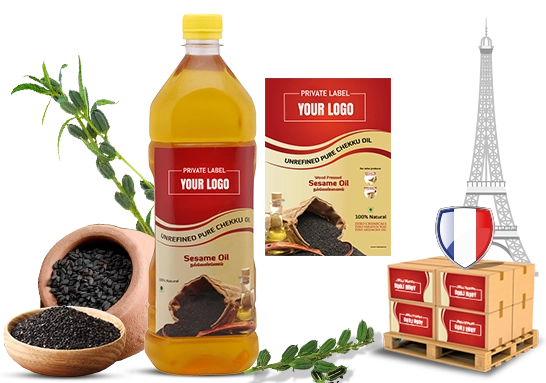 A bottle of cold pressed sesame oil shown with raw black sesame seeds and a wooden scoop.