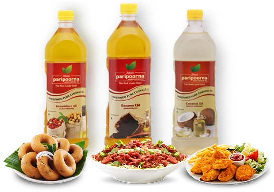 Three bottles of cold-pressed oil are arranged with assorted food items, showcasing their quality.